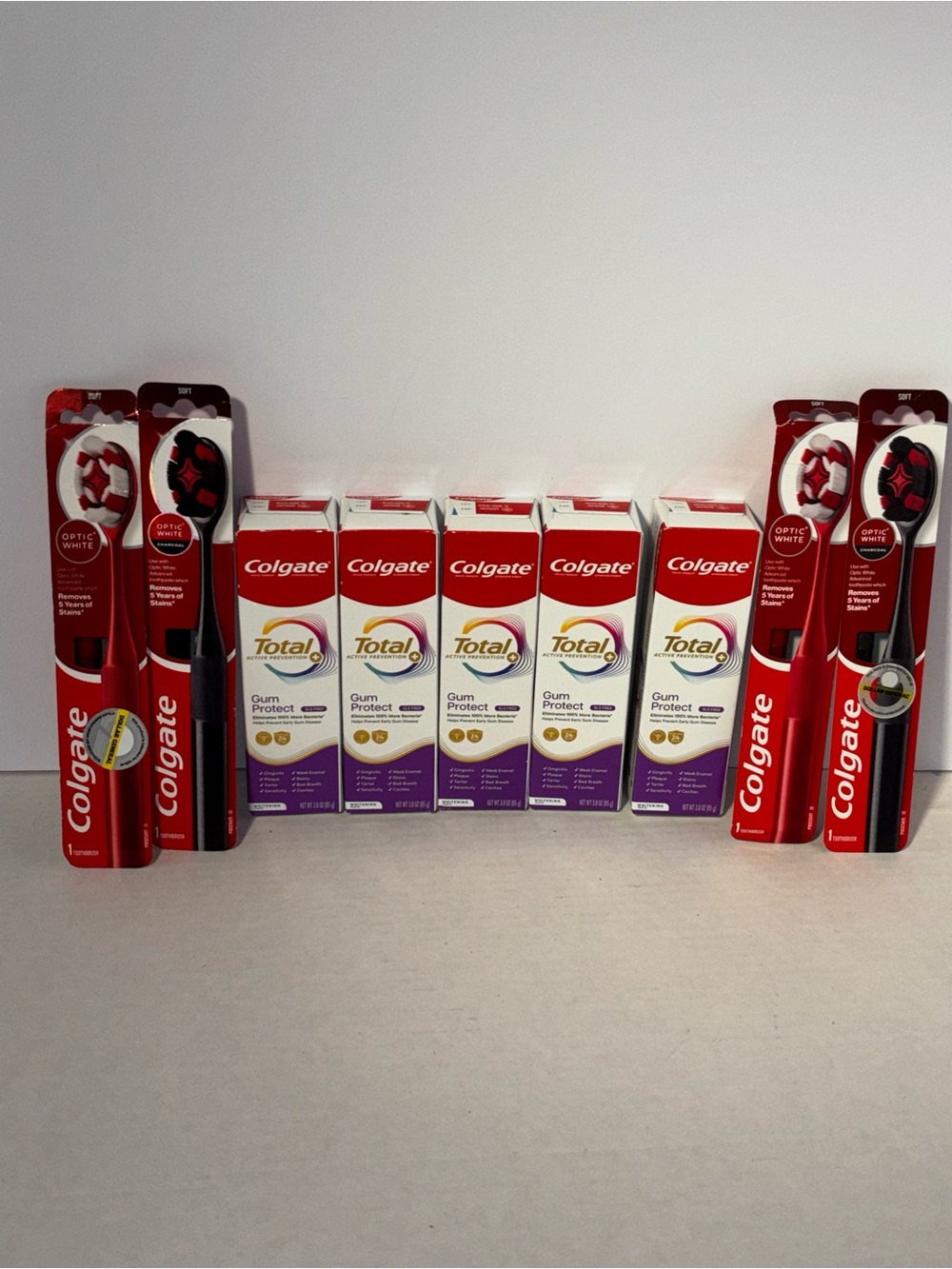 Colgate Total Gum Protect Toothpaste 5pk,4x Optic White Toothbrushes Bundle of 9